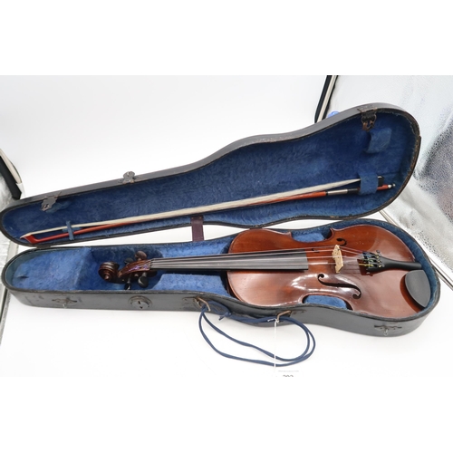 292 - A two piece back violin 35.5cm together with a bow 70 grams and a violin case