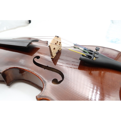 292 - A two piece back violin 35.5cm together with a bow 70 grams and a violin case