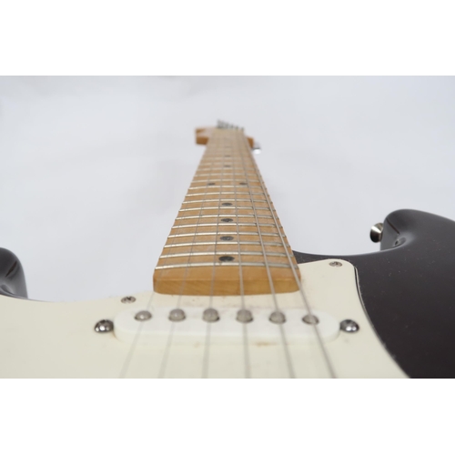 294 - FENDER STRATOCASTER a Mexican left handed electric guitar in plum with cream scratch plate. Serial n... 