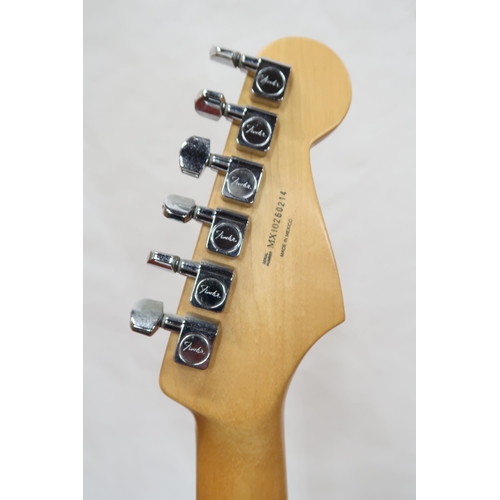 294 - FENDER STRATOCASTER a Mexican left handed electric guitar in plum with cream scratch plate. Serial n... 