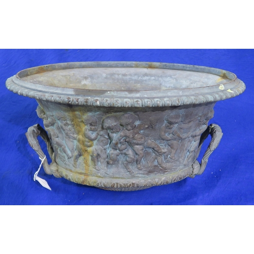 300C - A bronzed birdbath in the form of an antique urn with twin acanthus handles and figures from a bacch... 