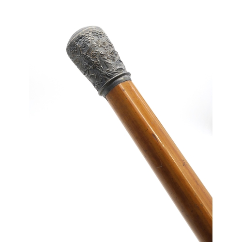 357 - A Malacca walking cane, with embossed Chinese white metal pommel, approximately 90cm in length