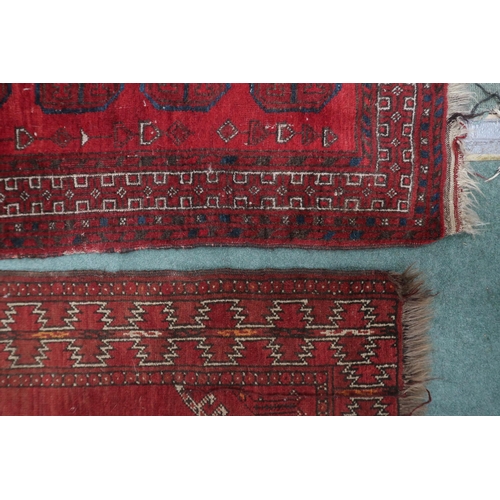 61 - A lot consisting red ground Bokhara rug, 133cm long x 92cm wide and a smaller red ground Bokhara sty... 