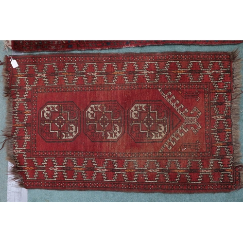 61 - A lot consisting red ground Bokhara rug, 133cm long x 92cm wide and a smaller red ground Bokhara sty... 