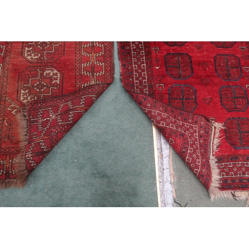 61 - A lot consisting red ground Bokhara rug, 133cm long x 92cm wide and a smaller red ground Bokhara sty... 