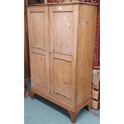 62 - An early 20th century beech two door hall robe, 146cm high x 92cm wide x 38cm deep