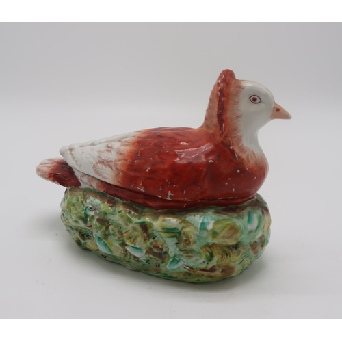 2155 - A LATE 19TH CENTURY PIGEON TUREENthe fancy brown and white pigeon modelled seated on a nest, 20cm lo... 