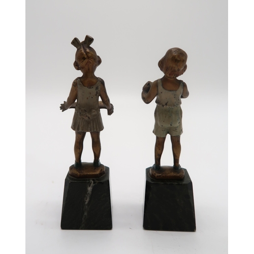 2158 - J.H. LAND - A pair of gilt bronze and enamel Art Deco figures, modelled as boy with accordion and gi... 