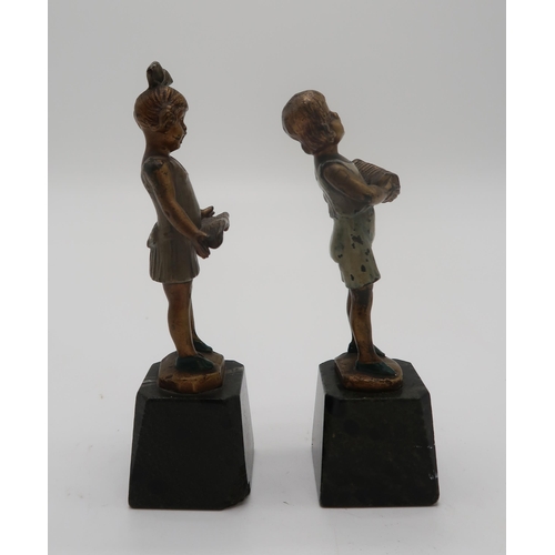 2158 - J.H. LAND - A pair of gilt bronze and enamel Art Deco figures, modelled as boy with accordion and gi... 