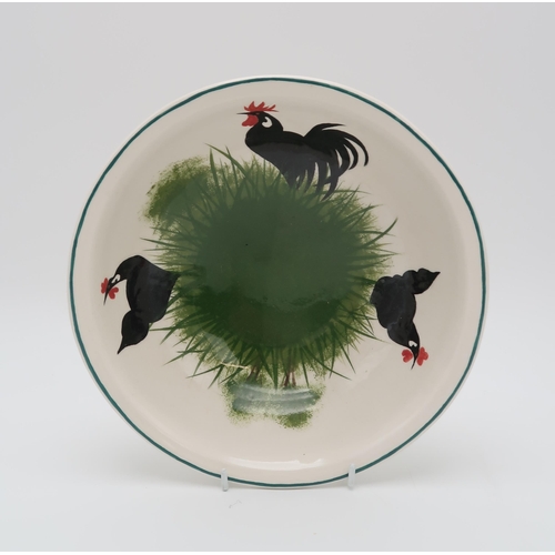 2167 - A WEMYSS TWO HANDLED POTTERY BOWLdecorated with a black cockerel and hens, printed Thomas Goode &... 