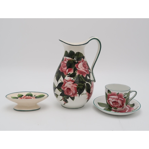 2169 - A COLLECTION OF WEMYSS CABBAGE ROSE PAINTED  POTTERYincluding a basket with twisted handle, 29cm lon... 