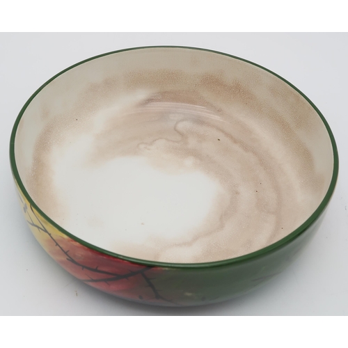 2172 - A JAZZY WEMYSS BOWL24.5cm diameter, together with two Scottish pottery money banks, one modelled as ... 