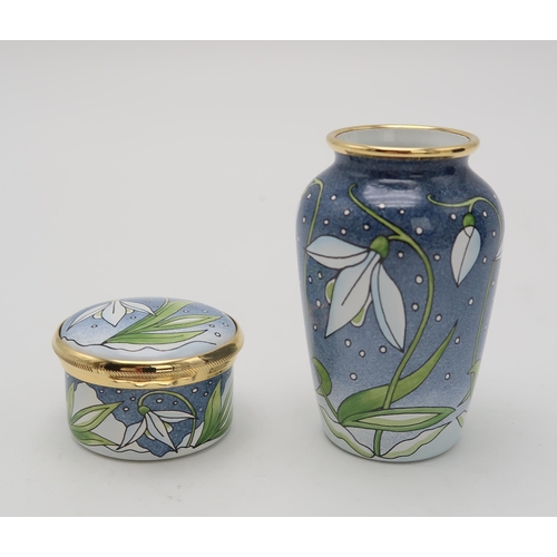 2175 - A MOORCROFT ENAMEL SNOWDROP TRINKET / PILL BOX4.5cm diameter, together with a matching enamel vase, ... 