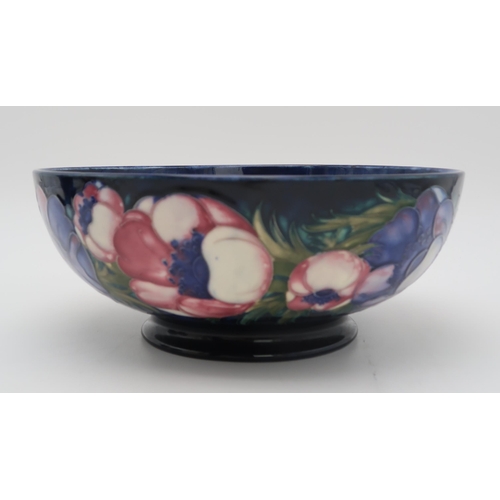 2177 - A LARGE MOORCROFT ANEMONE PATTERN BOWLwith tube line decoration of flowers to the exterior,  wi... 