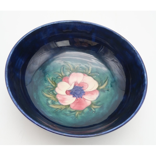 2177 - A LARGE MOORCROFT ANEMONE PATTERN BOWLwith tube line decoration of flowers to the exterior,  wi... 