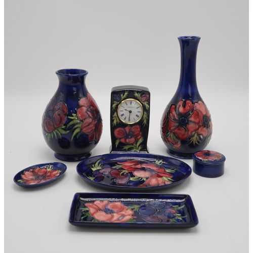 2181 - A COLLECTION OF MOORCROFT ANEMONE PATTERN PIECESincluding a bottle vase, 27cm high, a baluster vase,... 