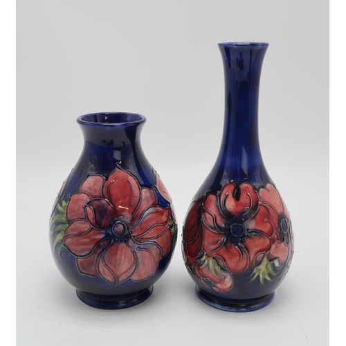 2181 - A COLLECTION OF MOORCROFT ANEMONE PATTERN PIECESincluding a bottle vase, 27cm high, a baluster vase,... 