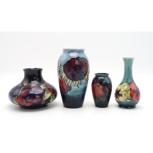 2182 - A COLLECTION OF MOORCROFT POTTERYincluding a squat Pansy vase on dark blue ground, 12cm high, a Anem... 