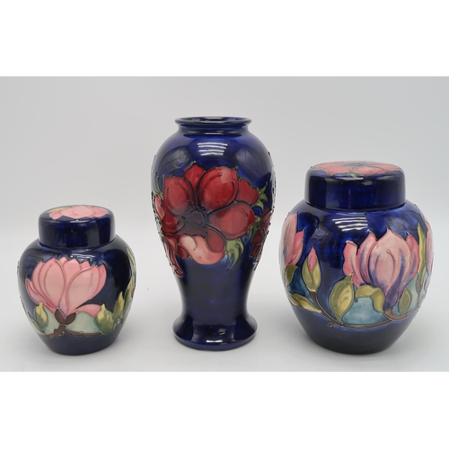 2183 - A COLLECTION OF MOORCROFT POTTERYincluding two Magnolia pattern ginger jars, one with an anemone pat... 