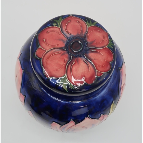 2183 - A COLLECTION OF MOORCROFT POTTERYincluding two Magnolia pattern ginger jars, one with an anemone pat... 