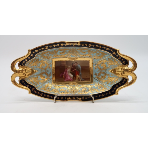 2184 - A VIENNA PORCELAIN DISHwith rams head handles, the centre painted panel of figures surrounded by a p... 