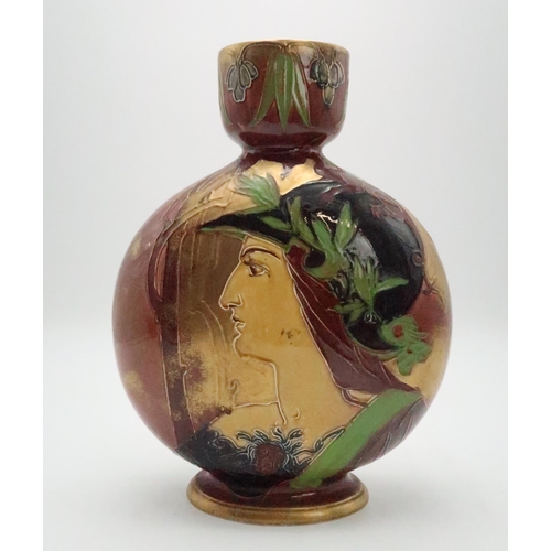 2185 - AN ENGLISH POTTERY MOON FLASKin the style of Thomas Forester, with tube line decoration of a woman, ... 