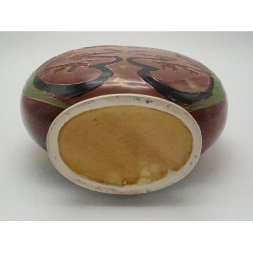 2185 - AN ENGLISH POTTERY MOON FLASKin the style of Thomas Forester, with tube line decoration of a woman, ... 