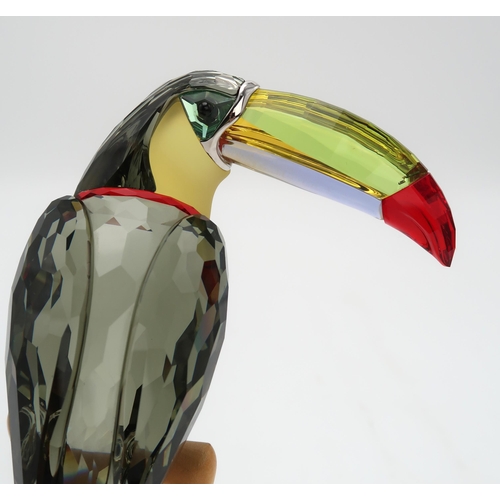 2197 - A SWAROVSKI CRYSTAL BIRDS OF PARADISE  FIGUREof a Toucan on wooden base, 20cm high... 