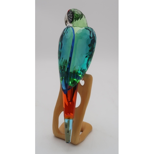 2199 - A SWAROVSKI CRYSTAL BIRDS OF PARADISE  FIGUREof a Macaw on wooden base, 23cm high... 