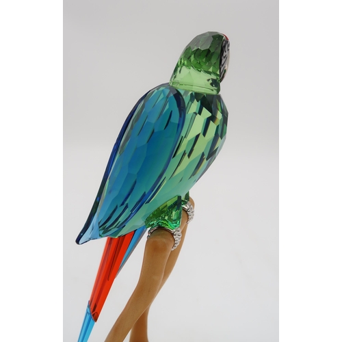 2199 - A SWAROVSKI CRYSTAL BIRDS OF PARADISE  FIGUREof a Macaw on wooden base, 23cm high... 