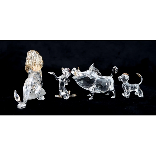 2202 - FOUR SWAROVSKI CRYSTAL WALT DISNEY CHARACTERS FROM THE LION KINGincluding Mufasa, Simba, Pumba, and ... 