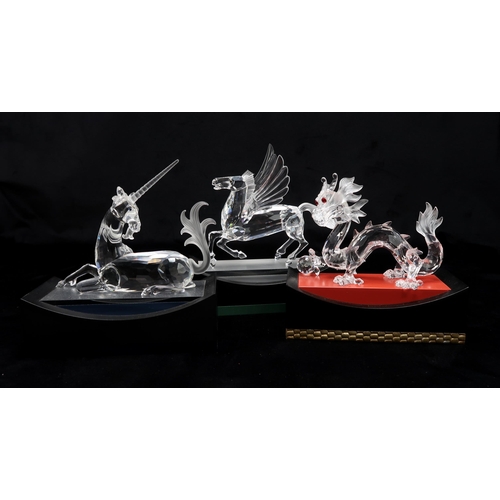 2210 - THE SWAROVSKI CRYSTAL FABULOUS CREATURES TRILOGY OF FIGUREScomprising Unicorn designed by Martin Zen... 