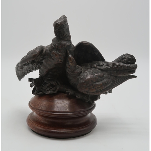 2220 - A BRONZE GROUP OF A PAIR OF PIGEONS OR DOVESprobably French, 21cm high on wooden base... 