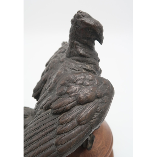 2220 - A BRONZE GROUP OF A PAIR OF PIGEONS OR DOVESprobably French, 21cm high on wooden base... 