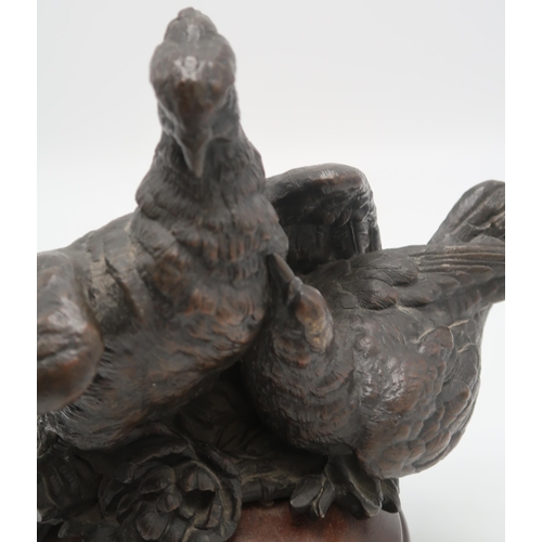 2220 - A BRONZE GROUP OF A PAIR OF PIGEONS OR DOVESprobably French, 21cm high on wooden base... 