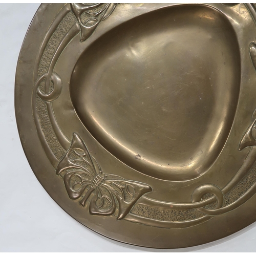 2225 - ATTRIBUTED TO MARGARET GILMOUR (1863-1942)Glasgow School, a brass charger embossed in low relief wit... 