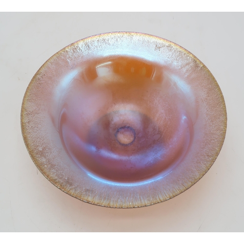 2230 - A WMF MYRA GLASS BOWLof open form with circular foot, in amber glass with blue iridescence, together... 