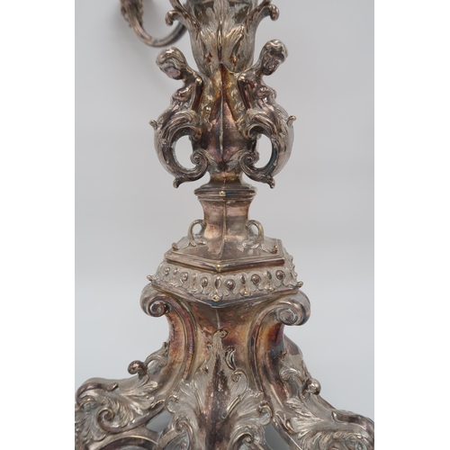 2420 - AN IMPRESSIVE SILVER-PLATED VICTORIAN FOUR BRANCH CANDELABRUM CENTREPIECEthe knopped baluster stem f... 