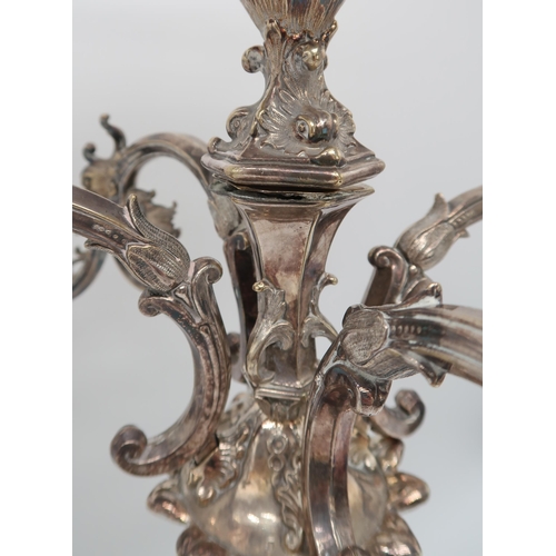 2420 - AN IMPRESSIVE SILVER-PLATED VICTORIAN FOUR BRANCH CANDELABRUM CENTREPIECEthe knopped baluster stem f... 