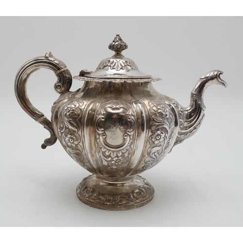 2430 - AN EARLY VICTORIAN SCOTTISH SILVER TEAPOTby Milne & Campbell, Edinburgh 1841, of lobed form, wit... 