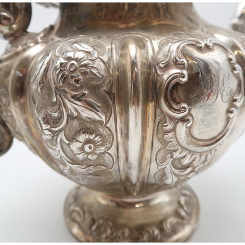 2430 - AN EARLY VICTORIAN SCOTTISH SILVER TEAPOTby Milne & Campbell, Edinburgh 1841, of lobed form, wit... 