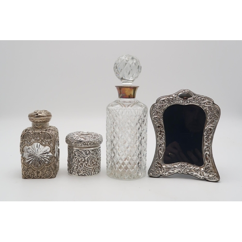 2431 - A COLLECTION OF SILVERincluding a late Victorian overlaid silver cut glass perfume flask, by William... 