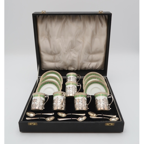 2438 - A CASED SET OF SILVER MOUNTED PORCELAIN COFFEE CANSthe porcelain by Crescent China, the silver by Co... 