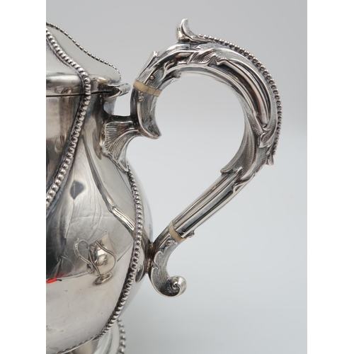 2439 - A MATCHED FOUR PIECE SILVER TEA SERVICEthe hot water pot and cream jug by Robert Hennell II, London ... 