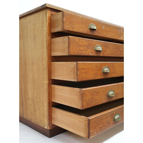 2012 - A 20TH CENTURY PITCH PINE PLAN CHEST with five drawers on plinth base, 87cm high x 150cm wide x 77cm... 