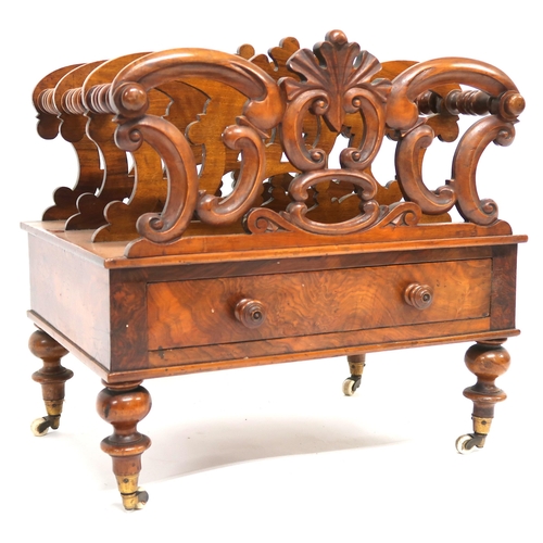 2014 - A VICTORIAN WALNUT CANTERBURY with four fretwork dividers joined by turned stretchers over single dr... 
