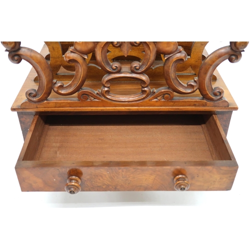 2014 - A VICTORIAN WALNUT CANTERBURY with four fretwork dividers joined by turned stretchers over single dr... 