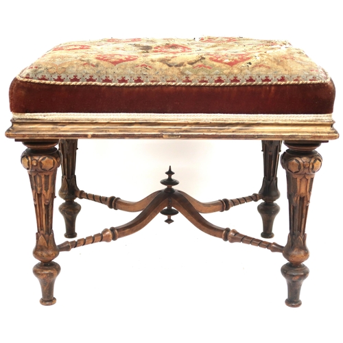 2015 - A 19TH CENTURY WALNUT FRAMED STOOL with tapestry upholstered seat on extensively carved turned suppo... 