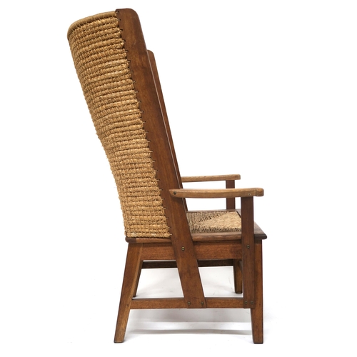 2016 - A 20TH CENTURY BEECH FRAMED ORKNEY CHAIR with rush backrest over rush drop in seat flanked by shaped... 