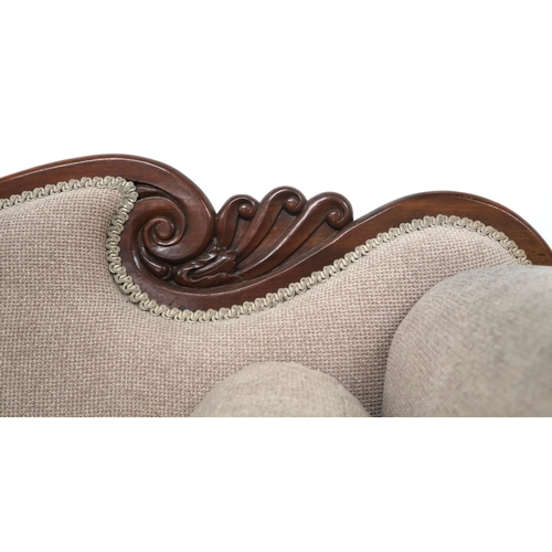 2019 - A 19TH CENTURY MAHOGANY FRAMED SCROLL ARMED SETTEE with shaped carved backrest over beige buttoned u... 